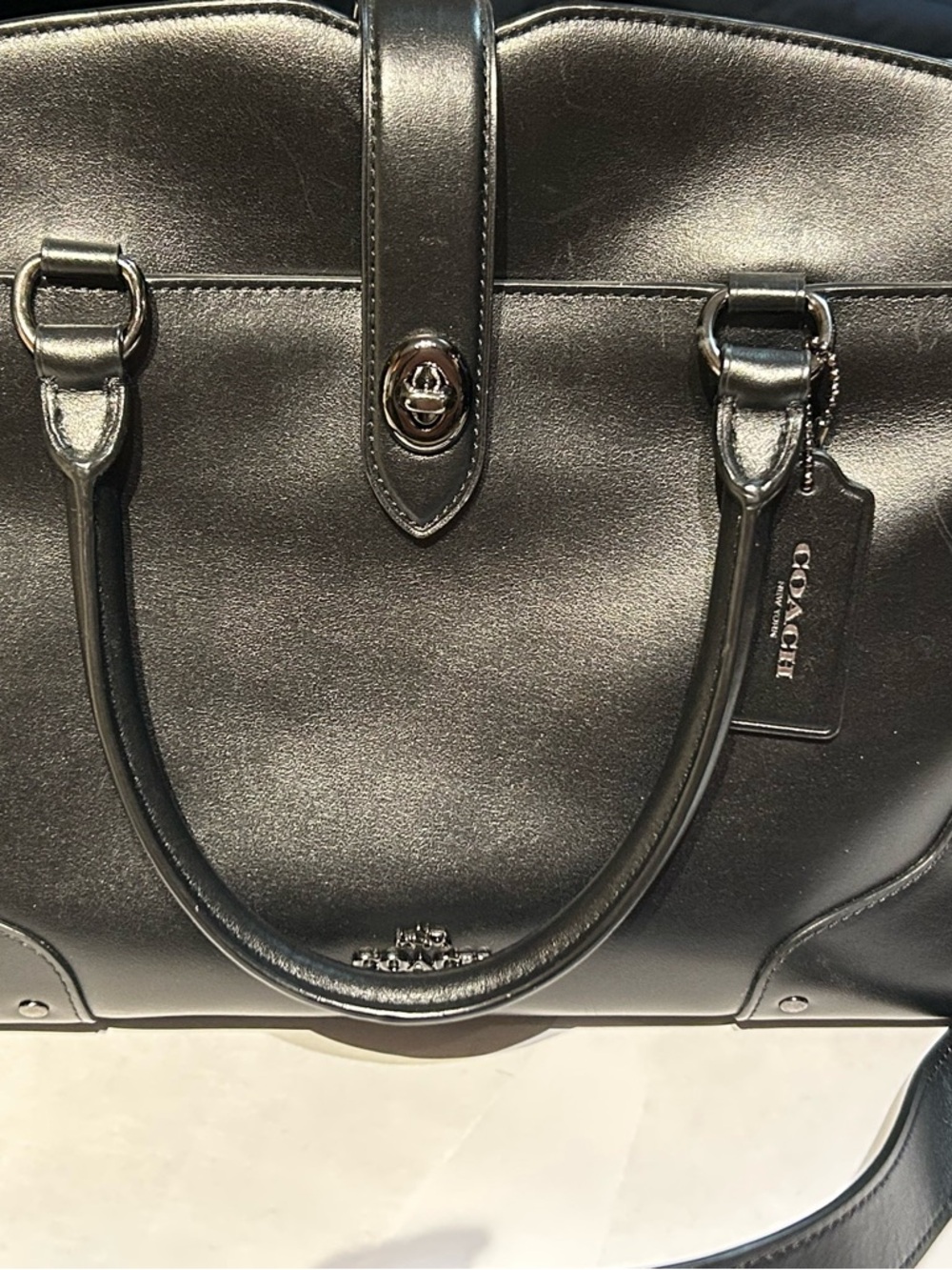 Coach Black Leather Coach Mercer 30 satchel with crossbody strap.